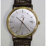 An Omega Quartz 9ct gold circular cased gentleman's wristwatch, the signed silvered dial with centre