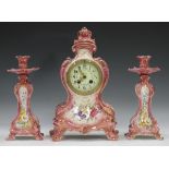 A late 19th century Royal Bonn pottery cased mantel clock garniture, the clock with French eight day