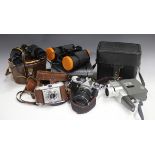 A collection of assorted cameras and lenses, including a Pentax ME Super with SMC Pentax-A 1:4 35-