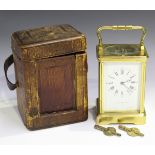 An early 20th century French lacquered brass cased carriage clock with eight day movement