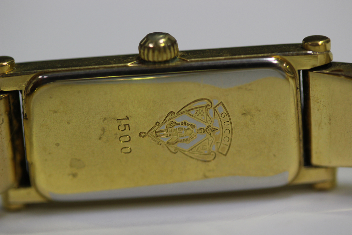 A Gucci gilt metal lady's bangle wristwatch with signed rectangular cream coloured dial, case - Image 4 of 4