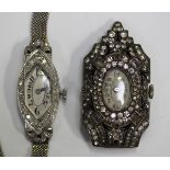 A platinum and diamond set oval cased lady's dress wristwatch with replacement battery movement,