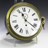 A late 19th century French brass circular cased ship's style wall timepiece, the unsigned movement