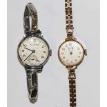 A Vertex Revue 9ct gold circular cased lady's bracelet wristwatch with signed jewelled movement, the