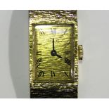 A Bueche Girod 9ct gold lady's bracelet wristwatch, the signed bark textured gilt dial with black