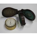 A late Victorian gilt lacquered brass cased pocket barometer, thermometer and compass, the