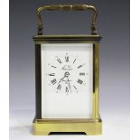 A 20th century French brass cased carriage timepiece with eight day movement, the enamelled dial