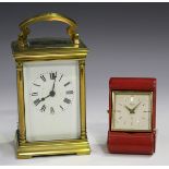 An early 20th century brass carriage timepiece with eight day movement, the case with arched top and