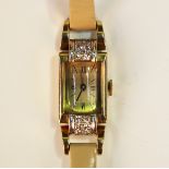 A French gold, platinum and diamond set lady's dress wristwatch with unsigned Swiss jewelled lever