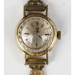 An Omega 18ct gold circular cased lady's wristwatch with signed jewelled lever movement, the