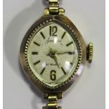 An Accurist 9ct gold oval cased lady's bracelet wristwatch, the signed oval dial with gilt Arabic