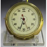 A mid-20th century brass ship's bulkhead timepiece, the brass movement with platform escapement,