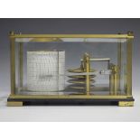 A 20th century brass cased barograph with gilt mechanism and recording drum, applied with a plaque