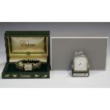 An Hermès Paris silver plated bedside timepiece with signed dial, the back numbered '129832', the