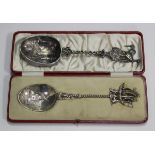 A George V Dutch style silver spoon, the bowl decorated with a windmill, the twisted stem with