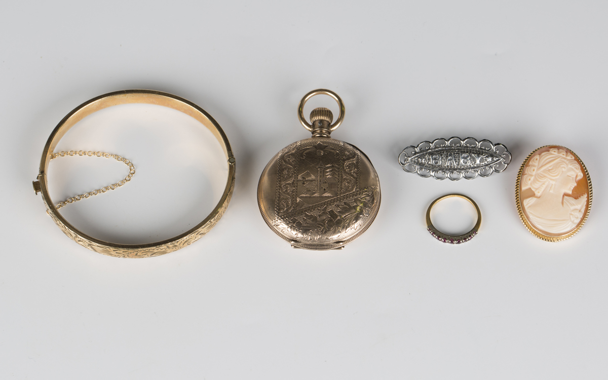 A gold mounted oval shell cameo pendant brooch, carved as a portrait of a lady, detailed 'Italy