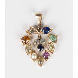 A gold and vari-coloured gem set pendant in an open heart shaped design, mounted with a variety of