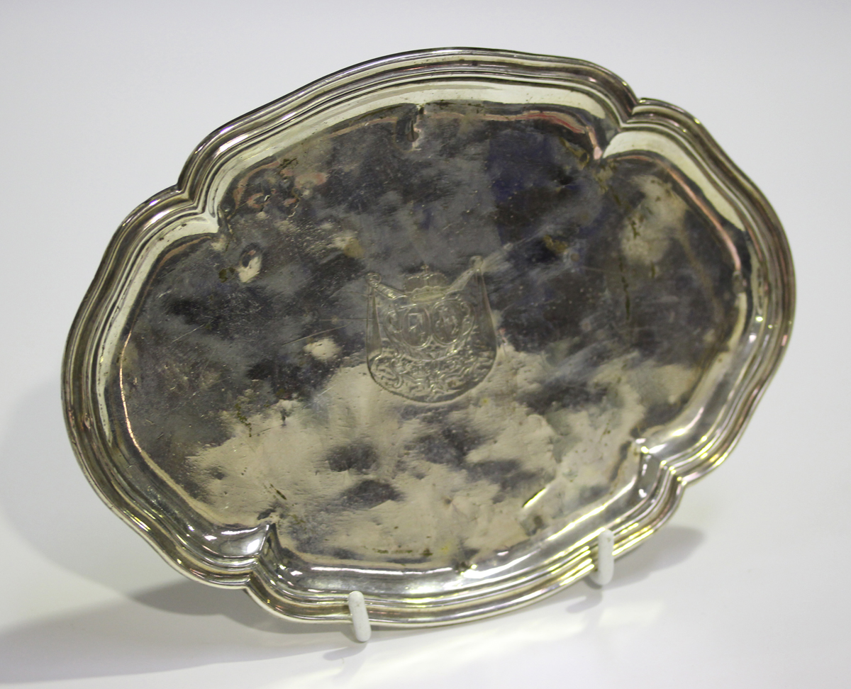 An 18th century Continental silver tray, probably French, of shaped oval outline, engraved with a