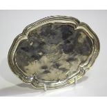 An 18th century Continental silver tray, probably French, of shaped oval outline, engraved with a
