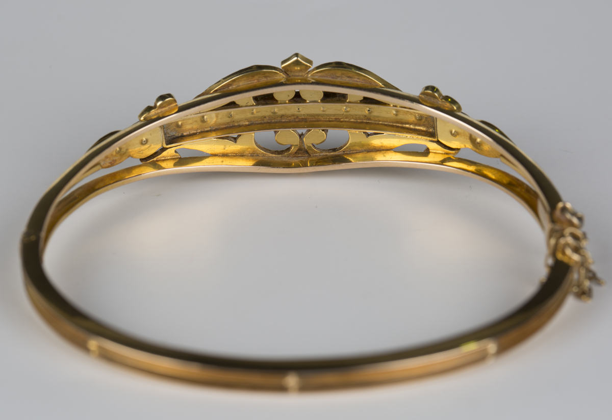 A gold, coral and seed pearl oval hinged bangle, circa 1910, the front in a pierced scrolling - Image 2 of 2