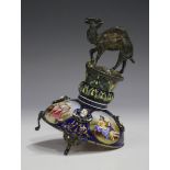 A late 19th century Viennese silver and enamel timepiece column, the silver camel surmount on a dome