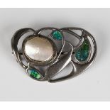 A Liberty & Co blister pearl and blue and green enamelled brooch in an Art Nouveau pierced design,