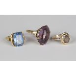 A gold ring, claw set with an oval cut amethyst, detailed '9ct', ring size approx L1/2, a 9ct gold