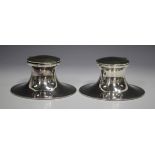 A pair of early 20th century Elkington plated capstan inkwells, each hinged lid engraved with 'The