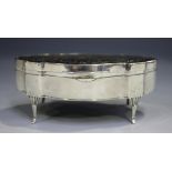 A George V Scottish silver and tortoiseshell jewellery box of shaped oval outline, the hinged lid