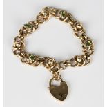 A gold and peridot bracelet in an interwoven and bead link design, collet set with four marquise cut