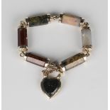 A Scottish gold and agate bracelet with gold mounted faceted agate links, on a gold and agate