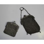 A silver chain mesh purse, fitted with a carrying chain and ring, import mark London 1915, width 7.