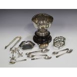 An Edwardian silver rose bowl of circular lobed form with ram's mask decoration, raised on a