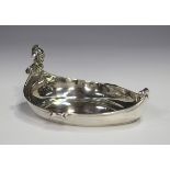 A George V silver dish of shallow boat form with jester head handle, Birmingham 1910 by