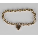 An Edwardian gold hollow oval link bracelet with a 9ct gold heart shaped padlock clasp, Birmingham