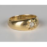 An 18ct gold ring, star gypsy set with a cushion cut diamond, London 1916, ring size approx N,