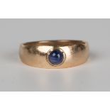 A gold ring, mounted with a cabochon sapphire, unmarked, ring size approx N.Buyer’s Premium 29.4% (