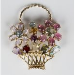 A gold and vari-coloured gemstone brooch, designed as a basket of flowers, mounted with a variety of