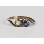 A gold, rose cut diamond and sapphire two stone ring in a crossover design, ring size approx S1/2.
