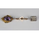 A Victorian gold and amethyst brooch, mounted with an oval cut amethyst, width 3.4cm, a rose cut