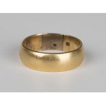 A gold wedding band, detailed '18', ring size approx X1/2 (with lower grade re-sizing inserts).