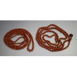 A single row necklace of graduated coral beads on a coral set snap clasp, detailed '.800', length