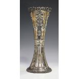 An Edwardian silver vase of tapering waisted form, decorated in relief with pendant bellflower and