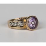 A Glen Lehrer gold limited edition amethyst and diamond ring, the circular cut amethyst mounted with