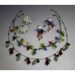 A group of mostly vari-coloured glass 1930s-50s costume jewellery, comprising a necklace with bird