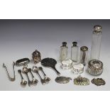 A small collection of silver and plated items, including various silver topped glass jars and