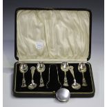 A set of six sterling silver coffee spoons and matching sugar tongs, import mark Birmingham 1909