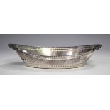 A late Victorian silver oval boat shaped basket with embossed bellflower festoons and pierced
