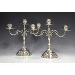 A pair of 20th century Mexican sterling silver twin scroll branch three-light candelabra, each ovoid