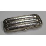 An Edwardian silver three-section cigar case with foliate scroll engraved decoration, Birmingham